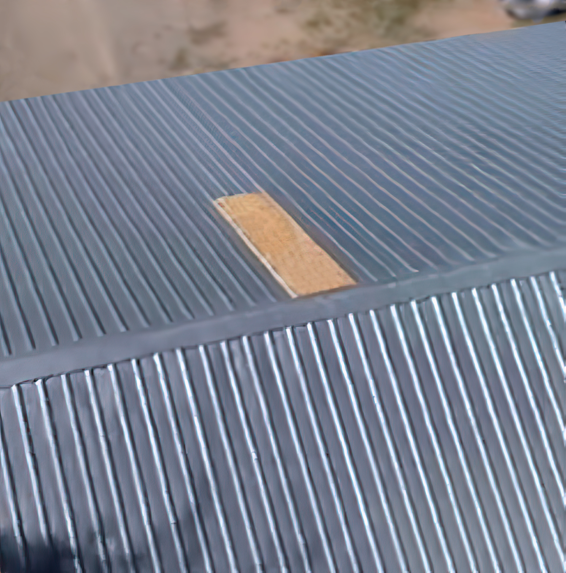 A picture of a metal roof before Polyurethane Insulated Roofing is applied.
